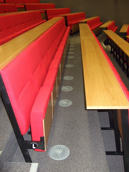Swirl diffusers in floor of lecture theatre